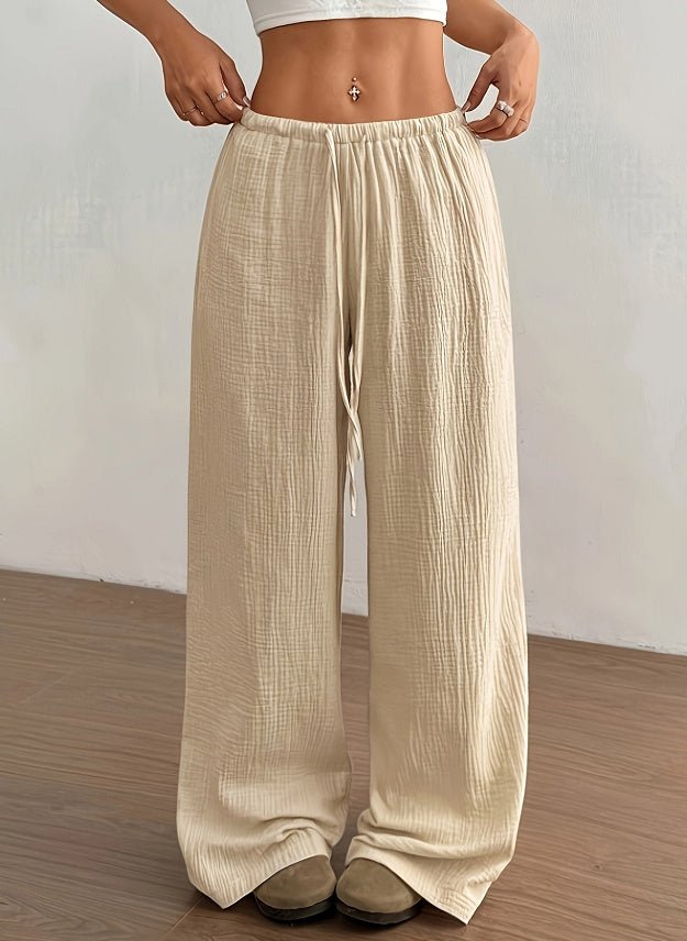 Pantalon femme décontracté beige avec taille élastique et lien de serrage pour un confort optimal