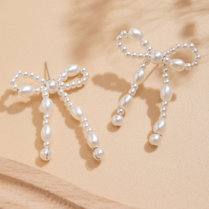 Boucles d'oreilles chic Moyyudé en forme de nœud avec perles blanches élégantes