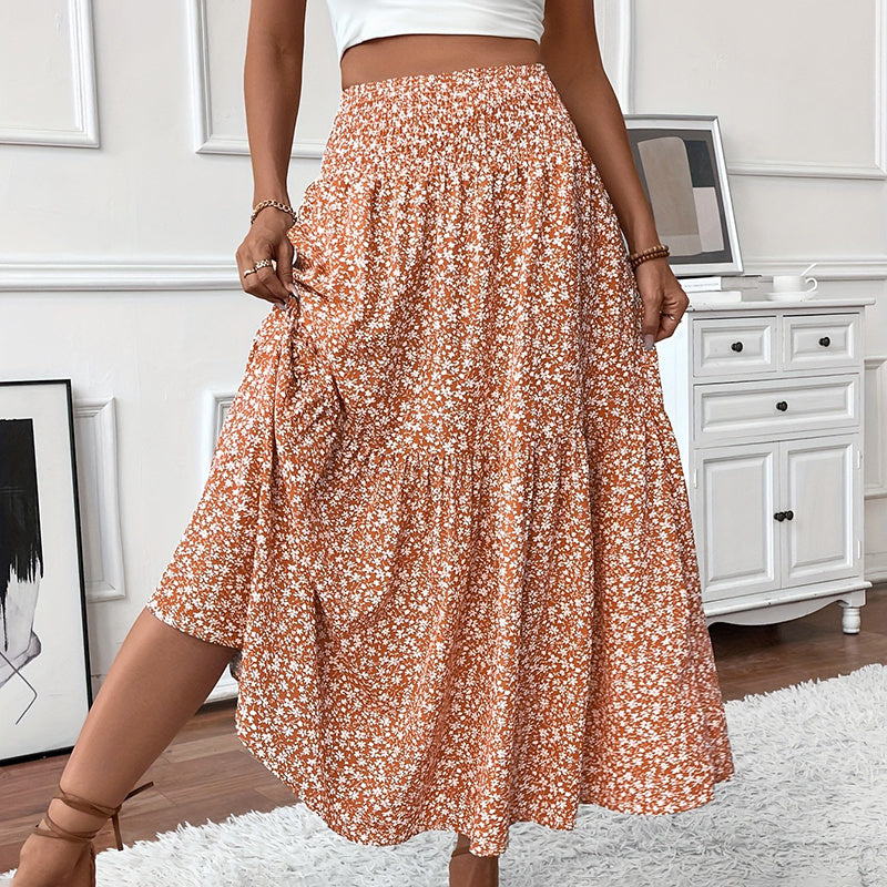 Jupe longue bohème chic Moyyudé à motifs floraux blancs sur fond orange pour un style élégant