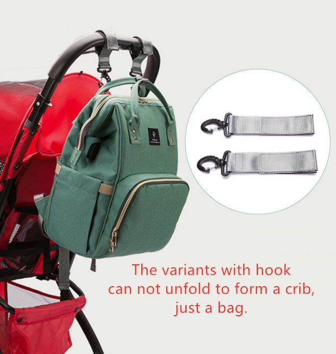 Sac à langer Moyyudé vert suspendu à une poussette avec accessoires de fixation inclus, sac a langer avec lit intégré